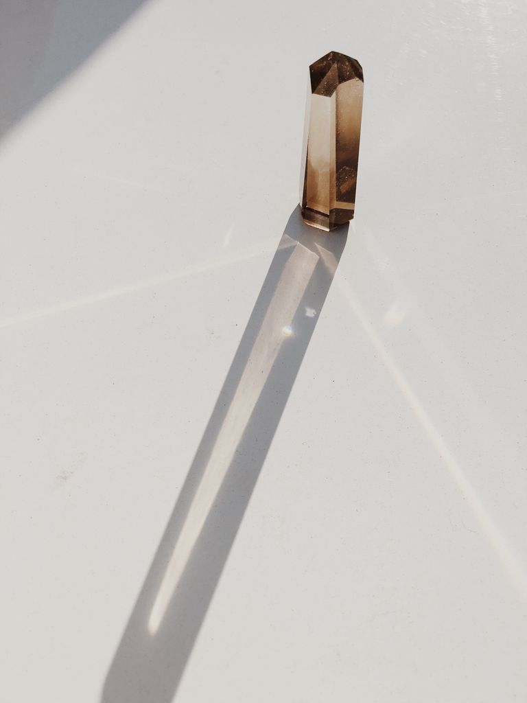 Close-Up Of Quartz On White Table