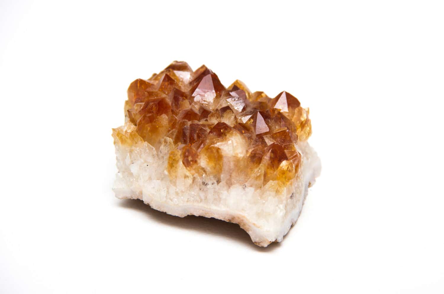 Detail of Citrine Quartz stone in white background.