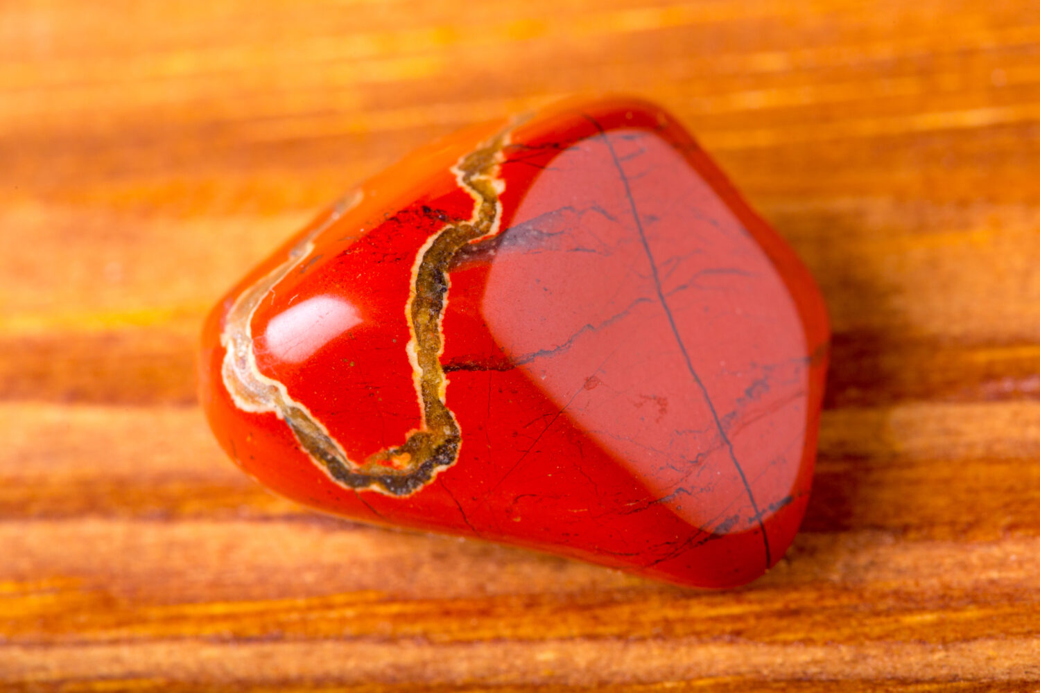 red jasper, close-up on a wooden table